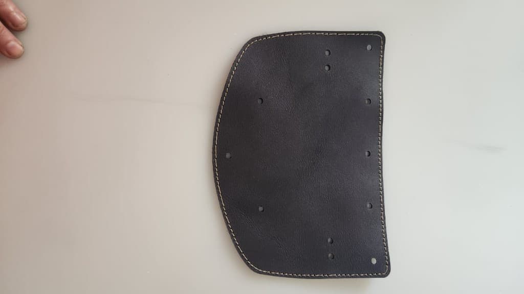 Dark brown leather bag flap with contrast stitching by Plaasjaap