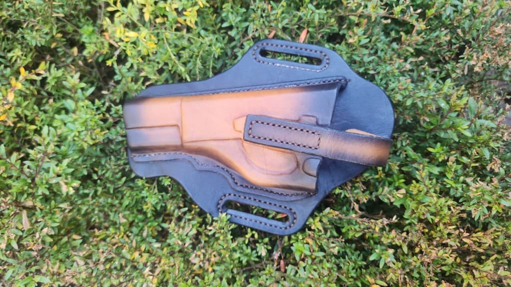 Handmade two-tone leather gun holster with belt loops by Plaasjaap